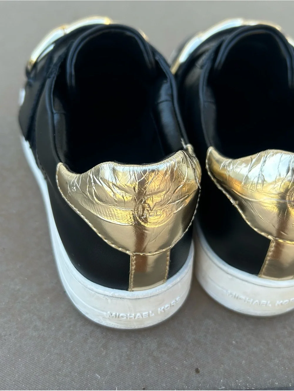 Michael Kors Kenna Black Leather Slip-On Sneakers with Gold Chain Accent Sz 8.5